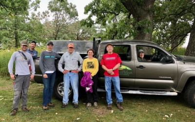 Volunteers with the Friends of Pheasant Branch in front of their work truck.