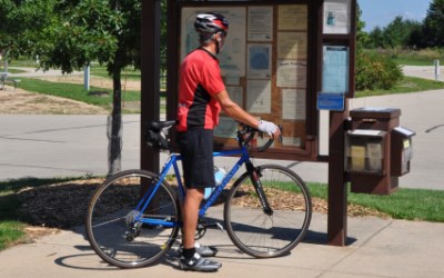 Capital City State Trail bike rider at kiosk